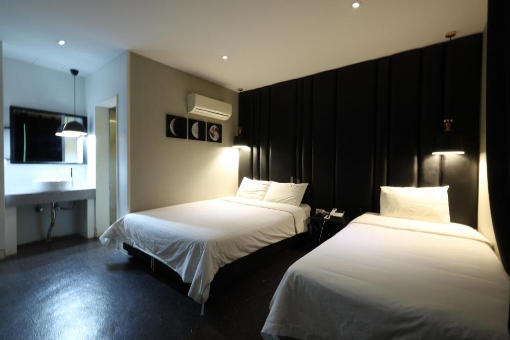 Postel nebo postele na pokoji v ubytování Ignis Hotel