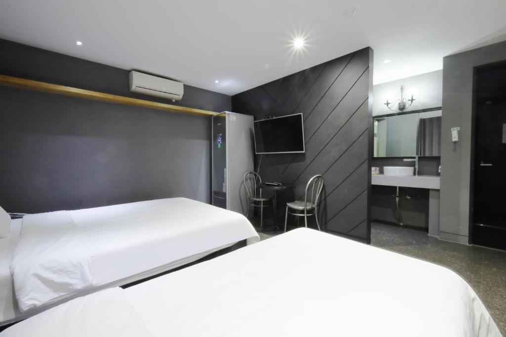 Postel nebo postele na pokoji v ubytování Ignis Hotel