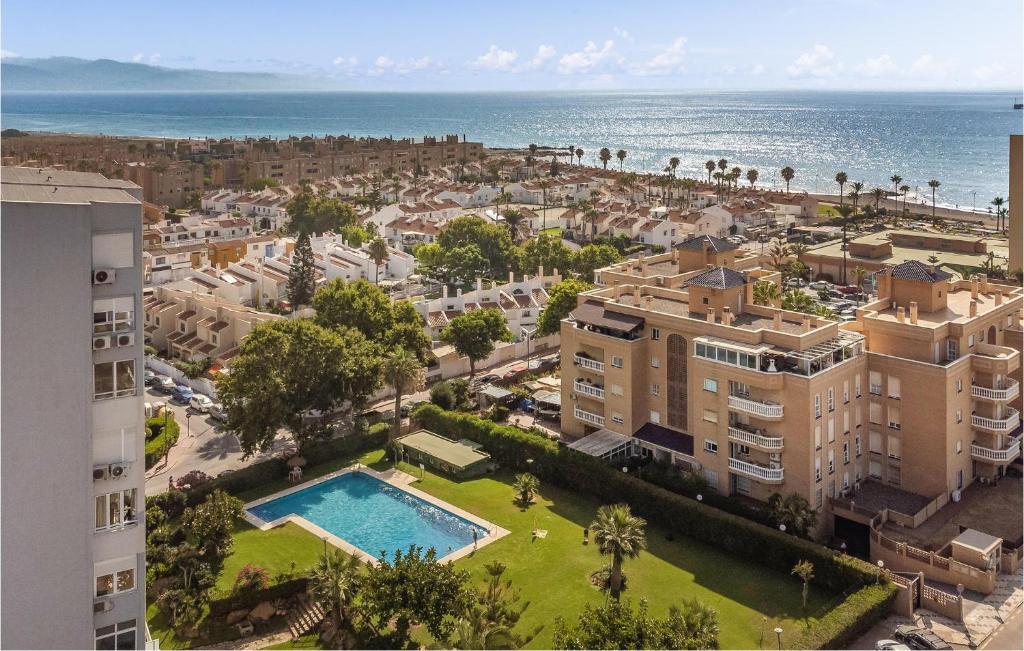 an aerial view of a city and the ocean at Gorgeous Apartment In Mlaga With House Sea View in Málaga