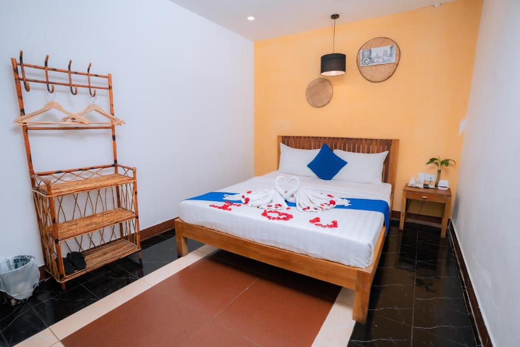 Postel nebo postele na pokoji v ubytování Grand Elevation Hotel