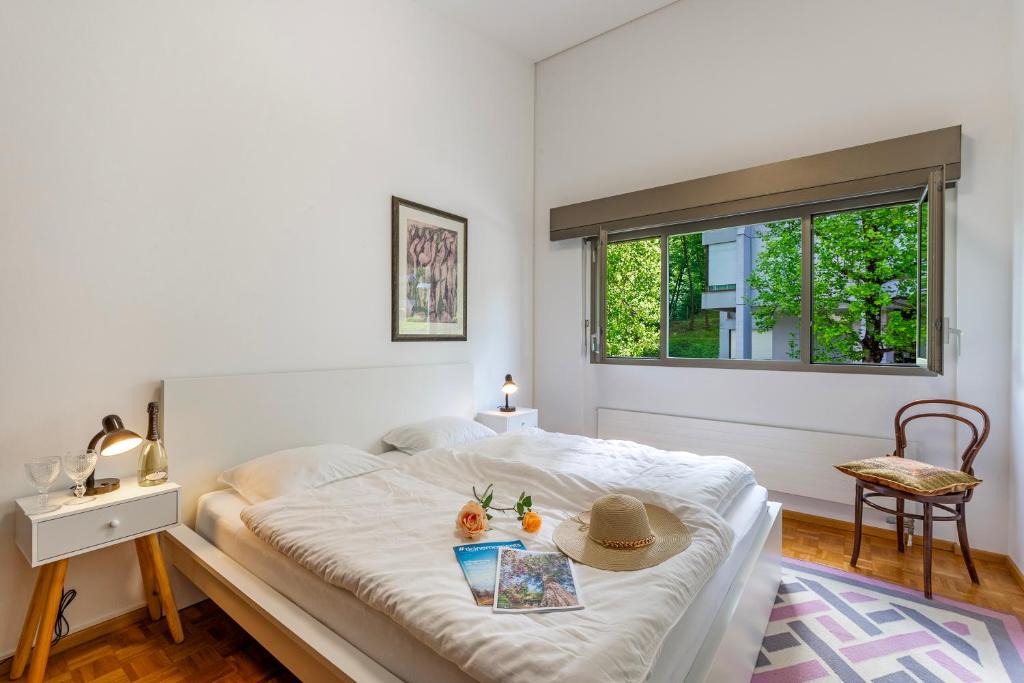 a bedroom with a bed with a hat on it at BoReal Apartments in Paradiso