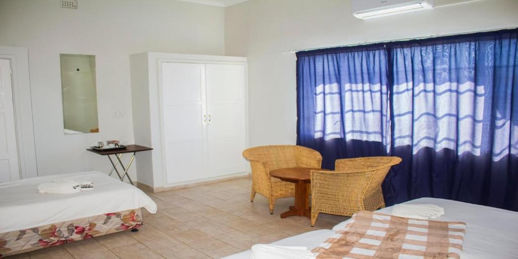 the FARMHOUSE BOUTIQUE GUESTHOUSE AND BEERGARDEN CC - Habitación Cuádruple Estándar