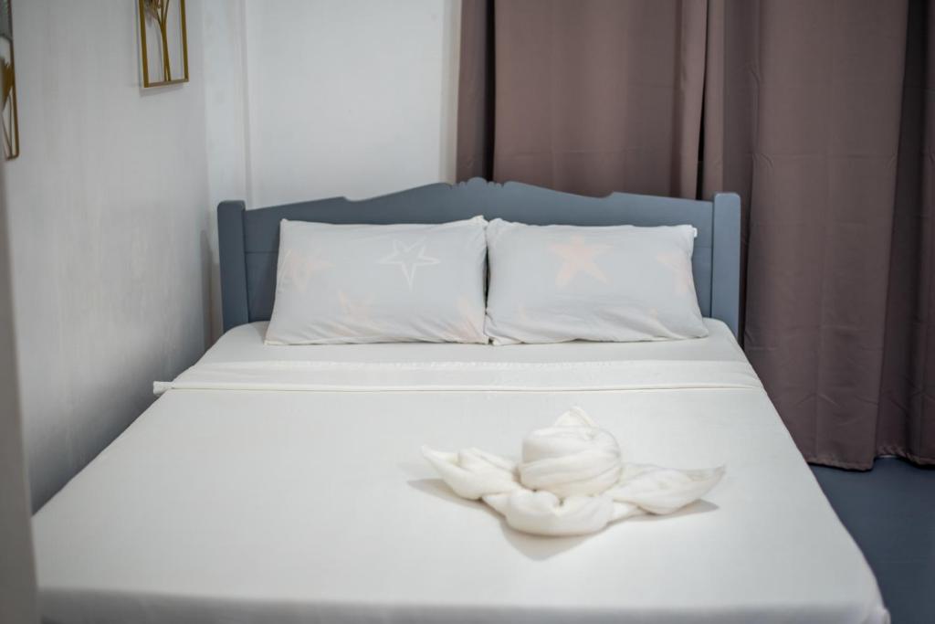 Postel nebo postele na pokoji v ubytování Dreamshore Ki'wi Beach Resort