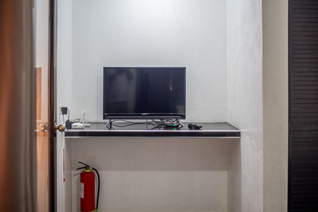 TV a/nebo společenská místnost v ubytování Dreamshore Ki'wi Beach Resort