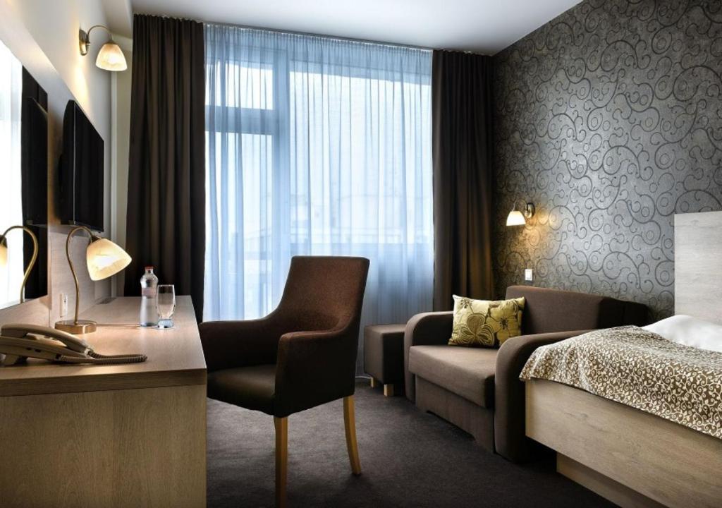 Postel nebo postele na pokoji v ubytování Hotel Magnólia