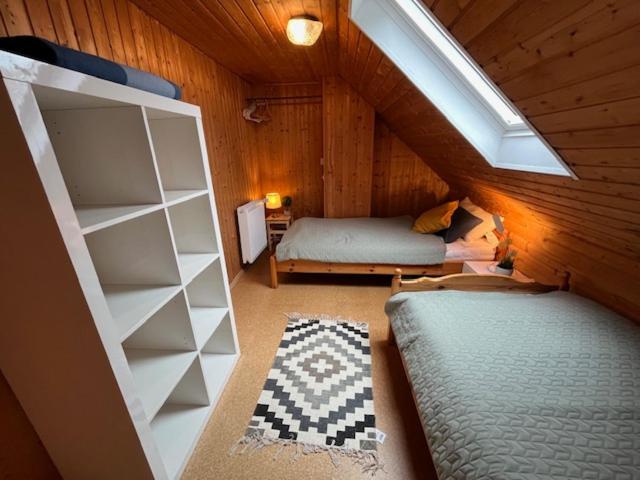 מיטה או מיטות בחדר ב-Ferienhus Aline