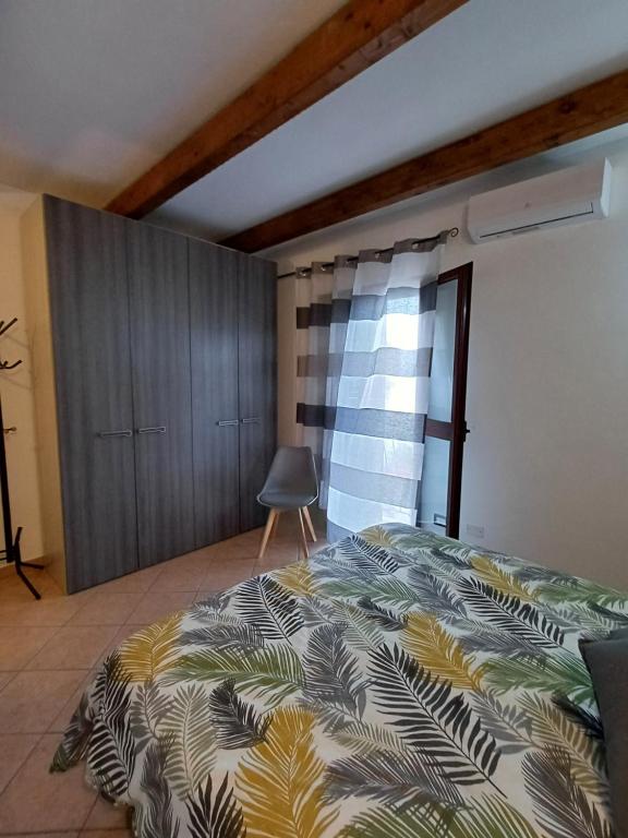 Postel nebo postele na pokoji v ubytování La dépendance di Andreina