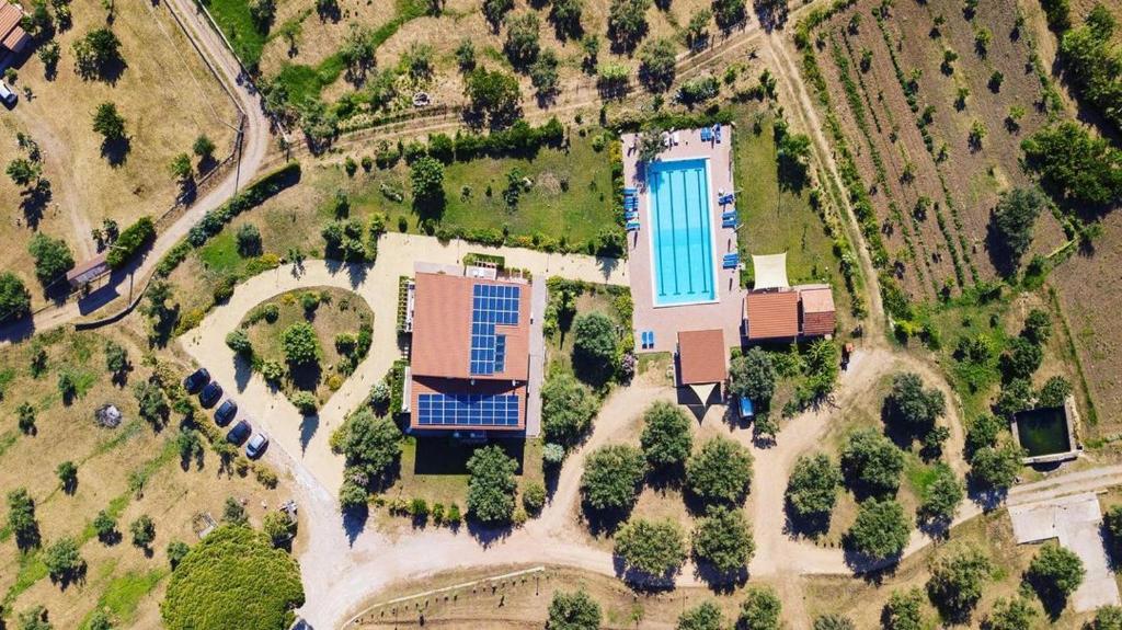 an aerial view of a house with solar panels on it at Case Mistretta in Altavilla Milicia