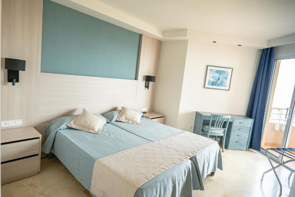 Postel nebo postele na pokoji v ubytování Aparthotel Dunes Platja