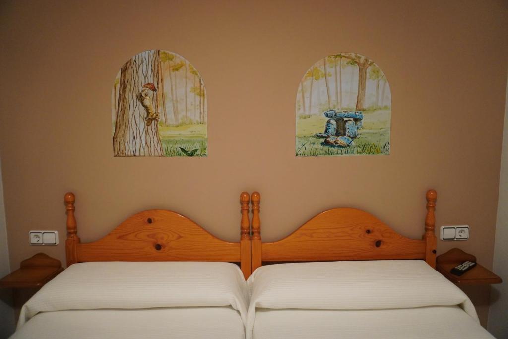 Postel nebo postele na pokoji v ubytování Apartamentos Casa DOMENC