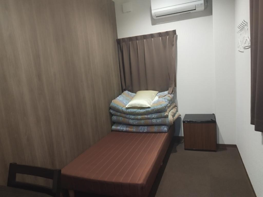 Postel nebo postele na pokoji v ubytování GATE80長居
