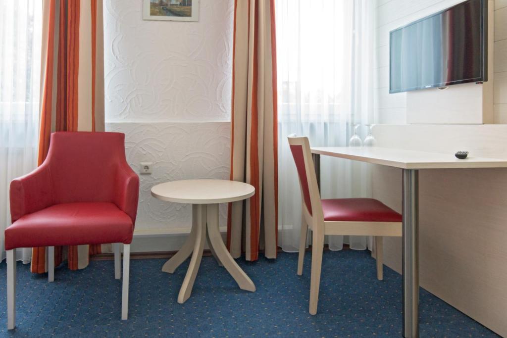 TV a/nebo společenská místnost v ubytování Apart Hotel Norden