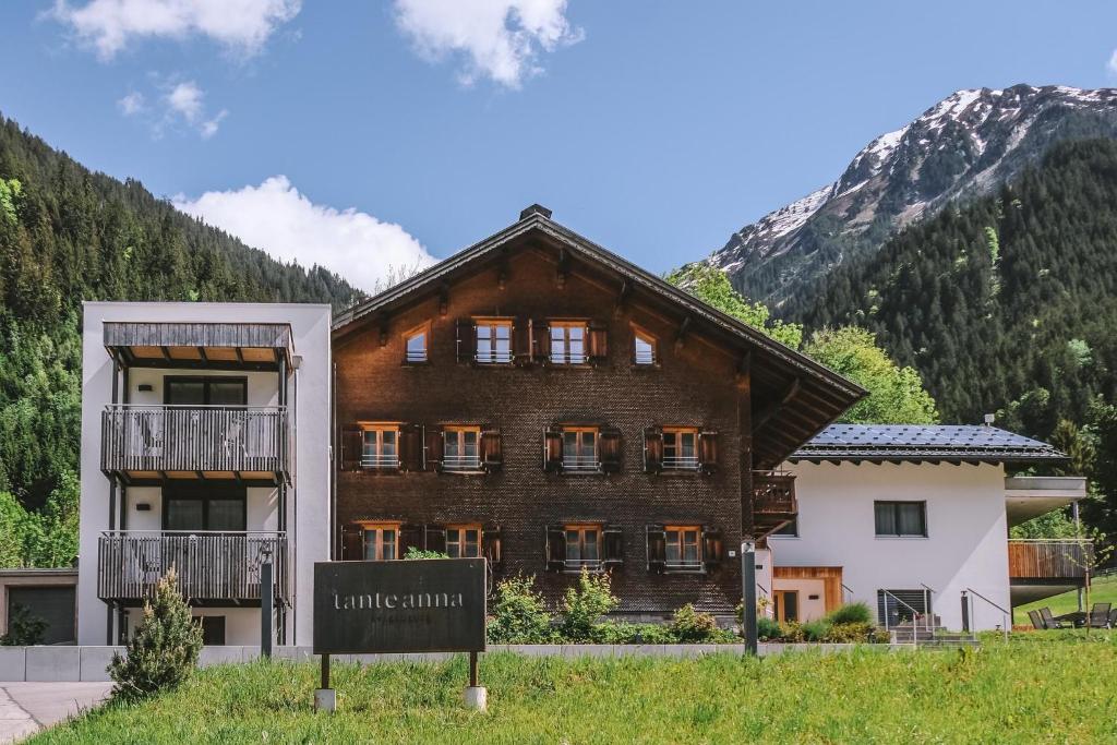 a building with a sign in front of it at Tante Anna Apartments in Sankt Gallenkirch
