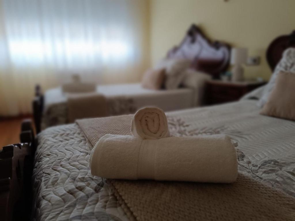 Rúm í herbergi á Baixo a Lua Rooming