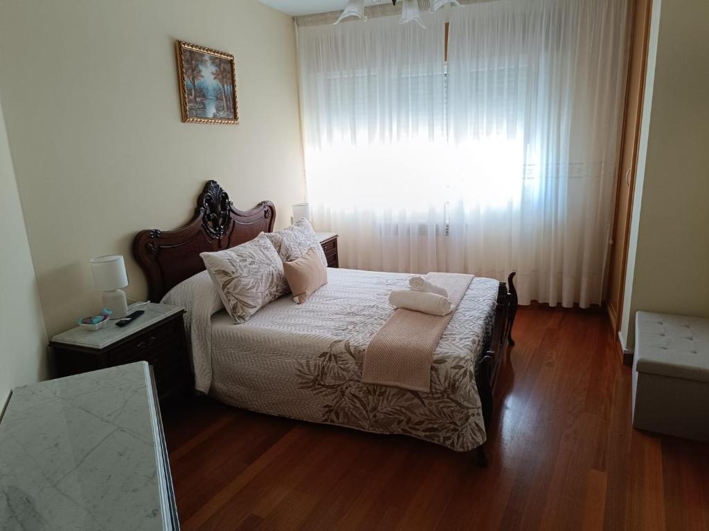 Rúm í herbergi á Baixo a Lua Rooming