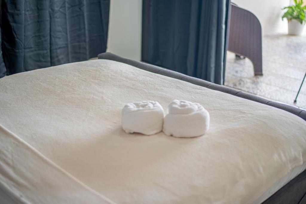 Postel nebo postele na pokoji v ubytování Dreamshore Ki'wi Beach Resort