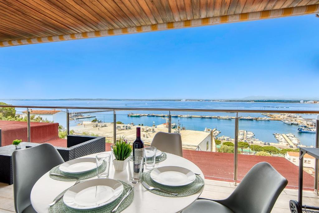 a dining room with a view of the water at Monaco 1A Puerto Roses - Barneda in Roses