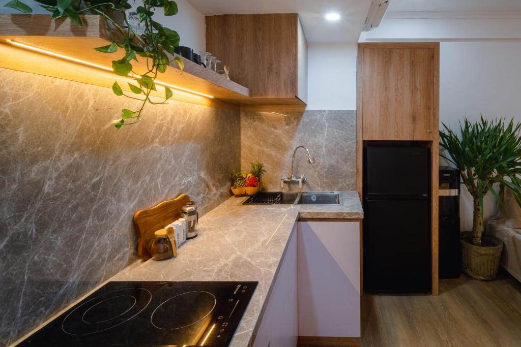 Kuchyň nebo kuchyňský kout v ubytování Sunset Suites, 1 bed apartment, Jayakarta hotel