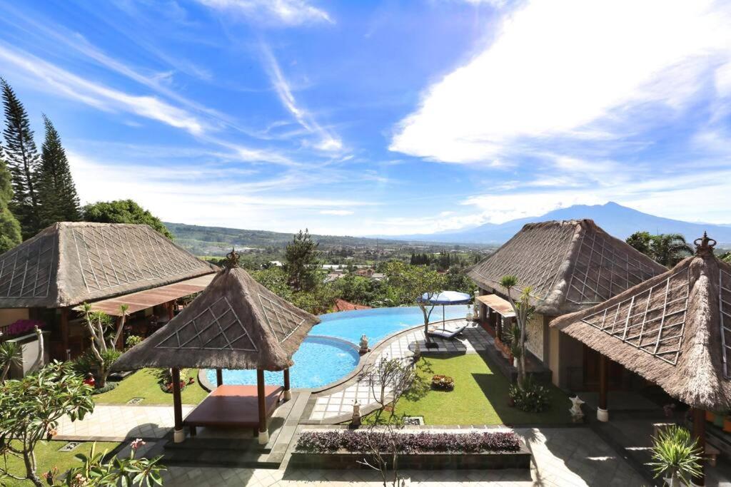 a view of a resort with a swimming pool at PURI BALI STANIA, Cisarua West Java in Cilama