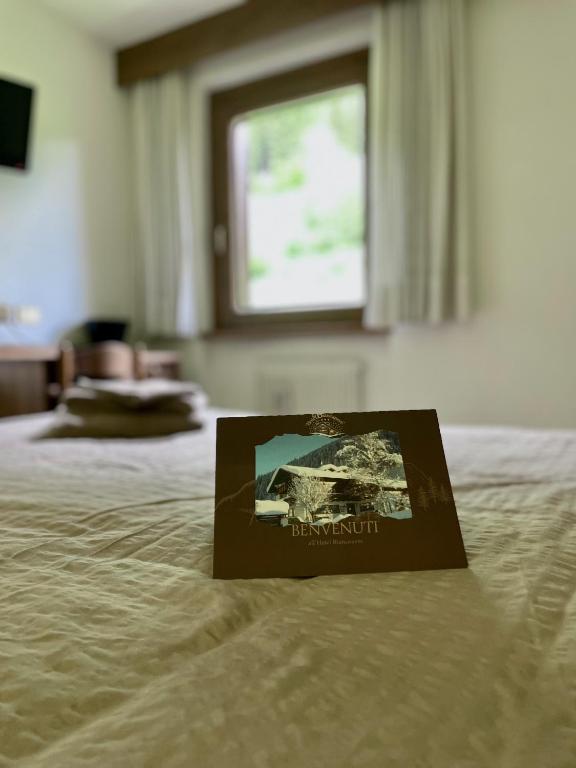 Postel nebo postele na pokoji v ubytování Hotel Biancaneve