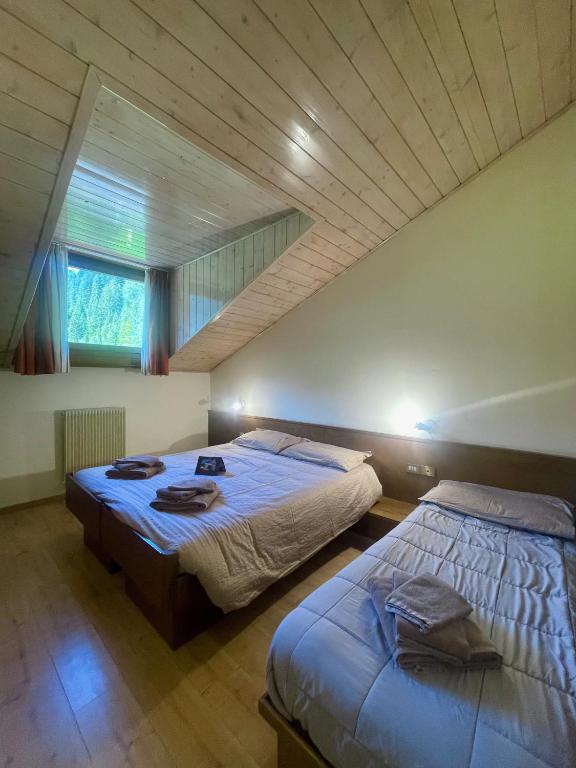 Postel nebo postele na pokoji v ubytování Hotel Biancaneve