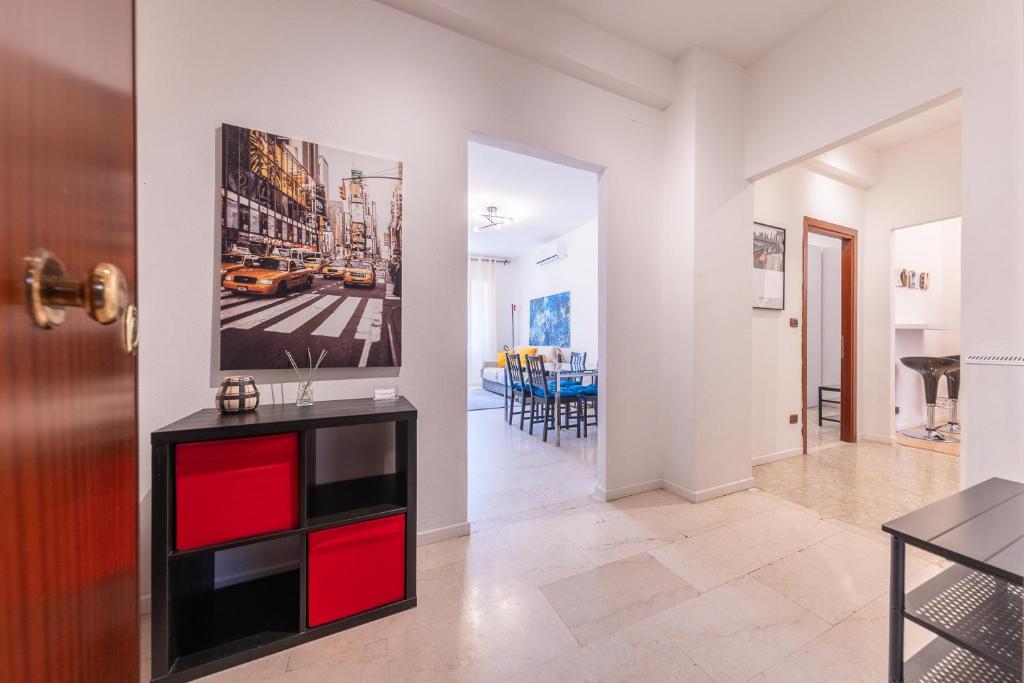 a hallway with a living room and a dining room at Lungotevere Apartment in Rome