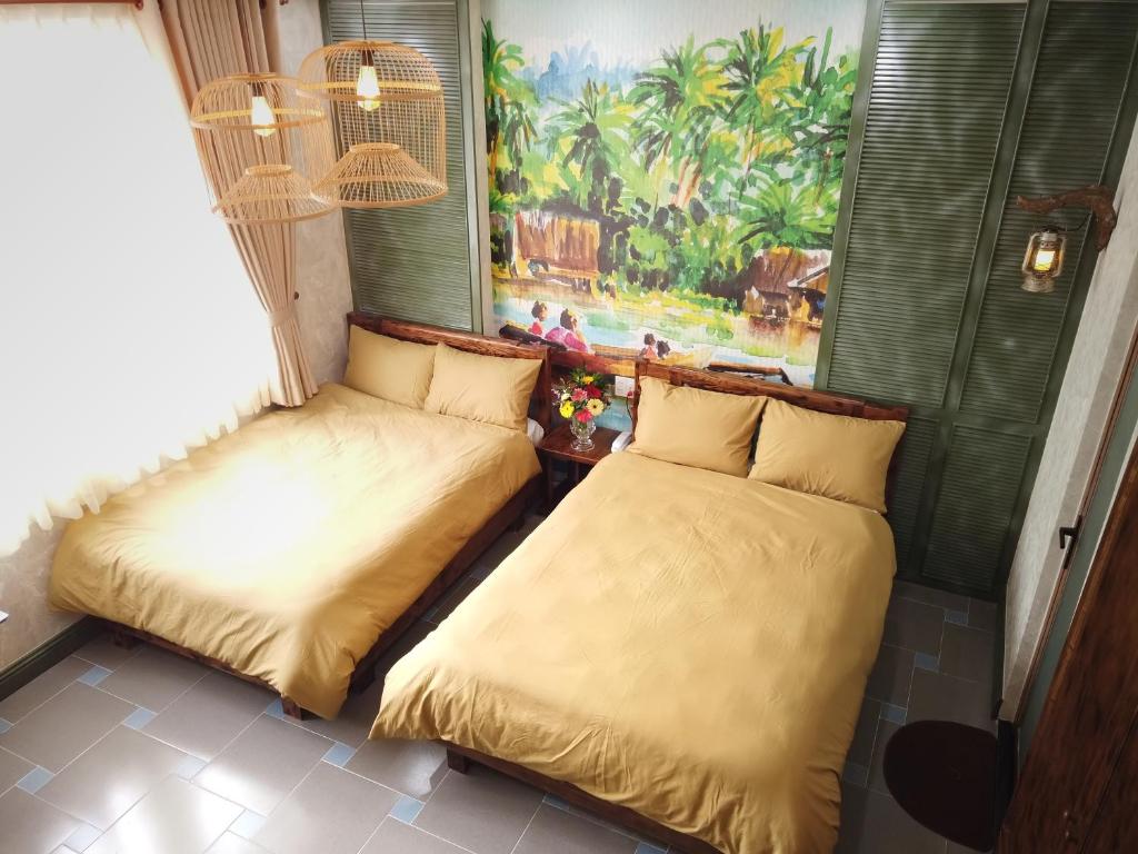 Giường trong phòng chung tại Free Style Hotel Dalat