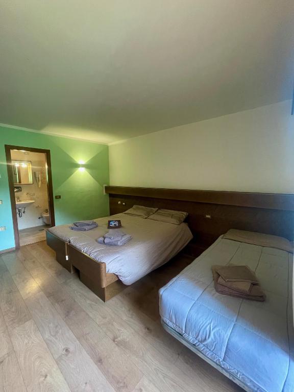Postel nebo postele na pokoji v ubytování Hotel Biancaneve