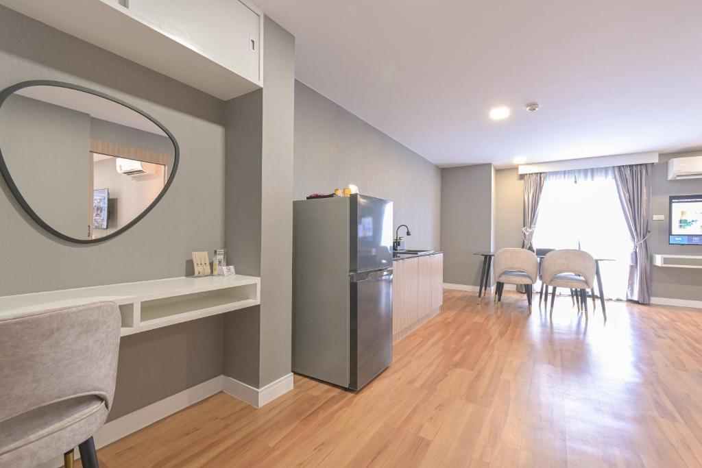 An open-plan living and dining area with a compact kitchen.