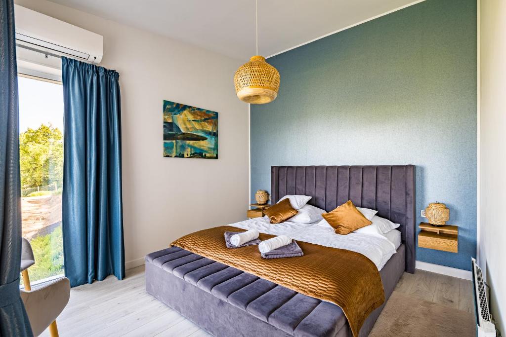 Posteľ alebo postele v izbe v ubytovaní Akvarell Apartmanház