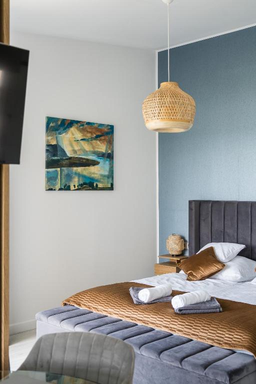 Posteľ alebo postele v izbe v ubytovaní Akvarell Apartmanház