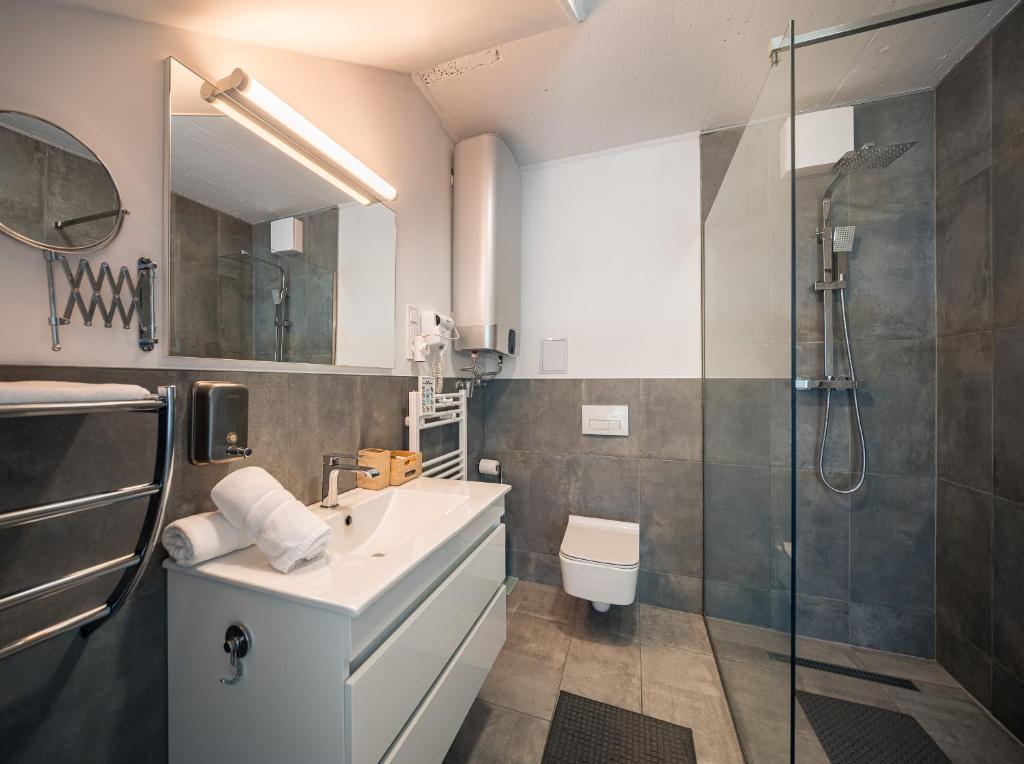 Kúpeľňa v ubytovaní Akvarell Apartmanház