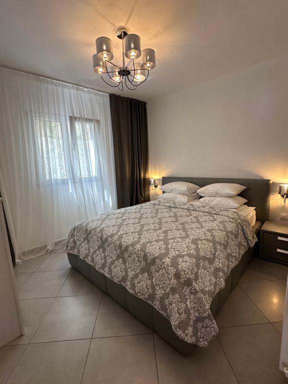 Postel nebo postele na pokoji v ubytování Serenity Apartment in Paliouri