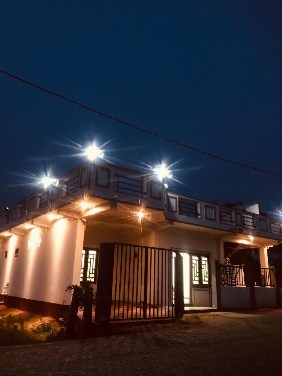 a building with lights on top of it at night at Ananyah Villa in Trincomalee
