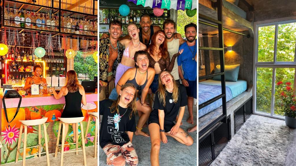 a group of people posing for a picture in a bar at Wonderland Jungle Hostel in Koh Tao