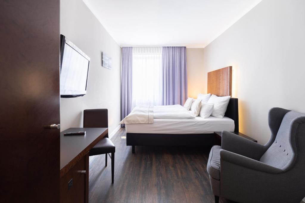 Postel nebo postele na pokoji v ubytování Select Hotel Friedrichshafen