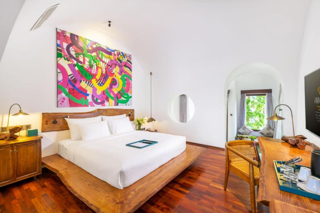 Postel nebo postele na pokoji v ubytování Anmira Resort & Spa Hoi An by The Unlimited Collection, Managed by the Ascott