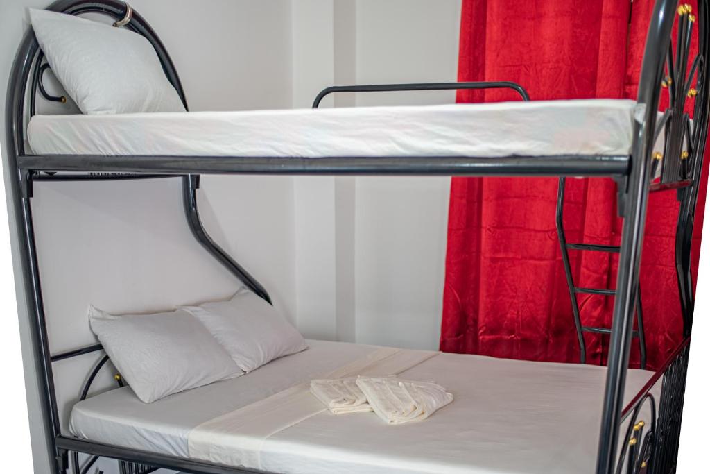Postel nebo postele na pokoji v ubytování Dreamshore Ki'wi Beach Resort