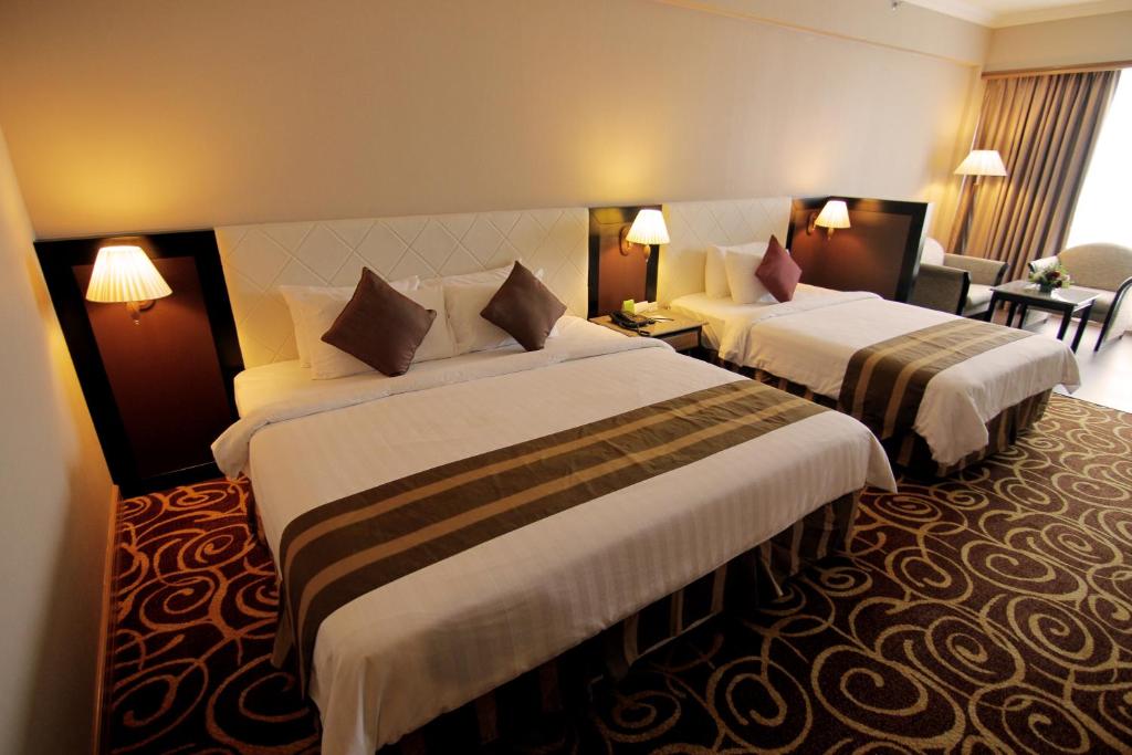 Mega Hotel Sdn Bhdにあるベッド