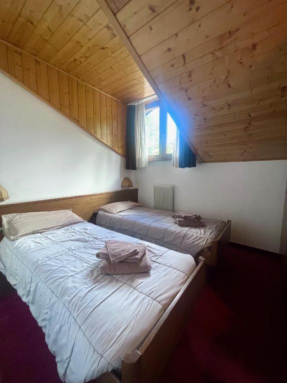Postel nebo postele na pokoji v ubytování Hotel Biancaneve