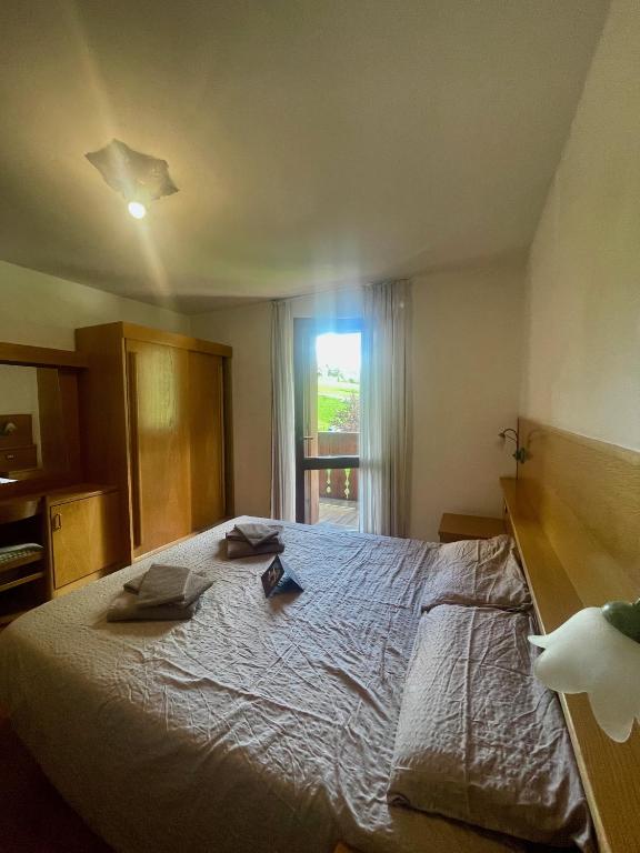 Postel nebo postele na pokoji v ubytování Hotel Biancaneve