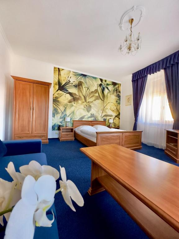 Postel nebo postele na pokoji v ubytování Hotel Růžek