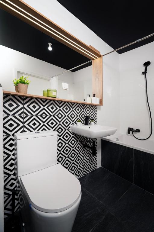 Kúpeľňa v ubytovaní Lumina cozy apartments Manufaktura