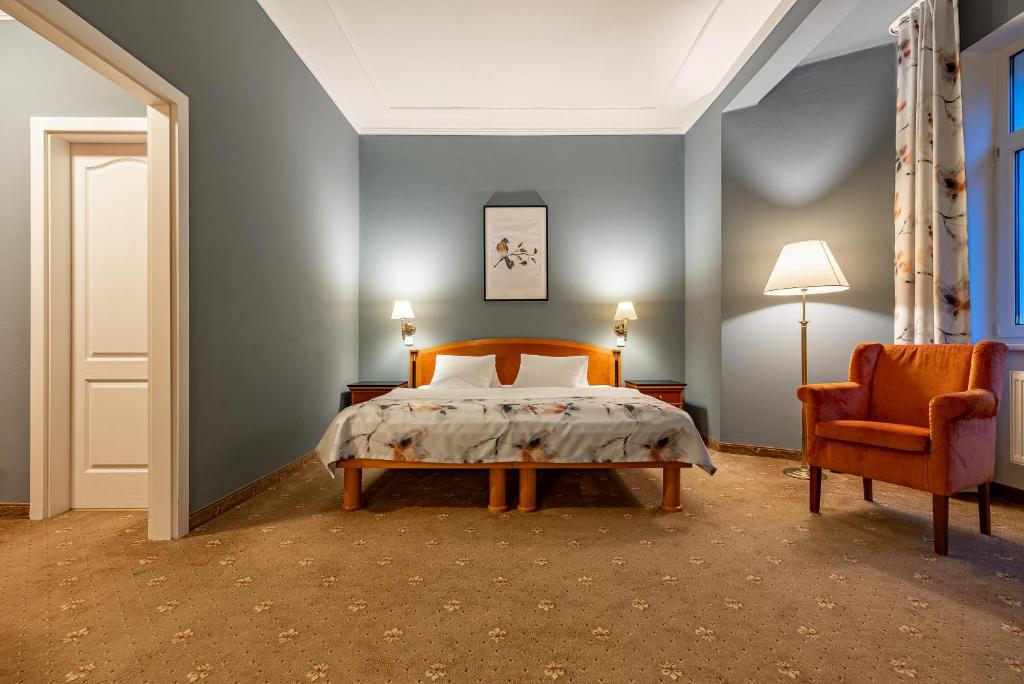 Postel nebo postele na pokoji v ubytování Spa & Wellness Hotel Silva