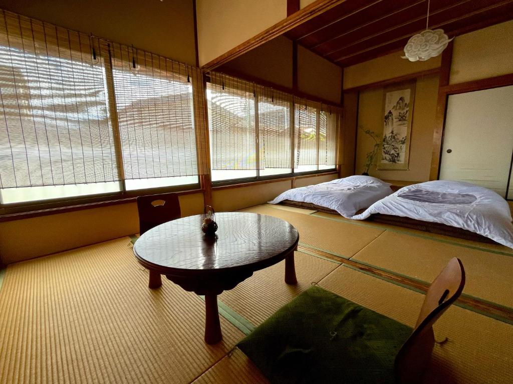 Postel nebo postele na pokoji v ubytování Japanese Traditional Inn Kamakura Rakuan
