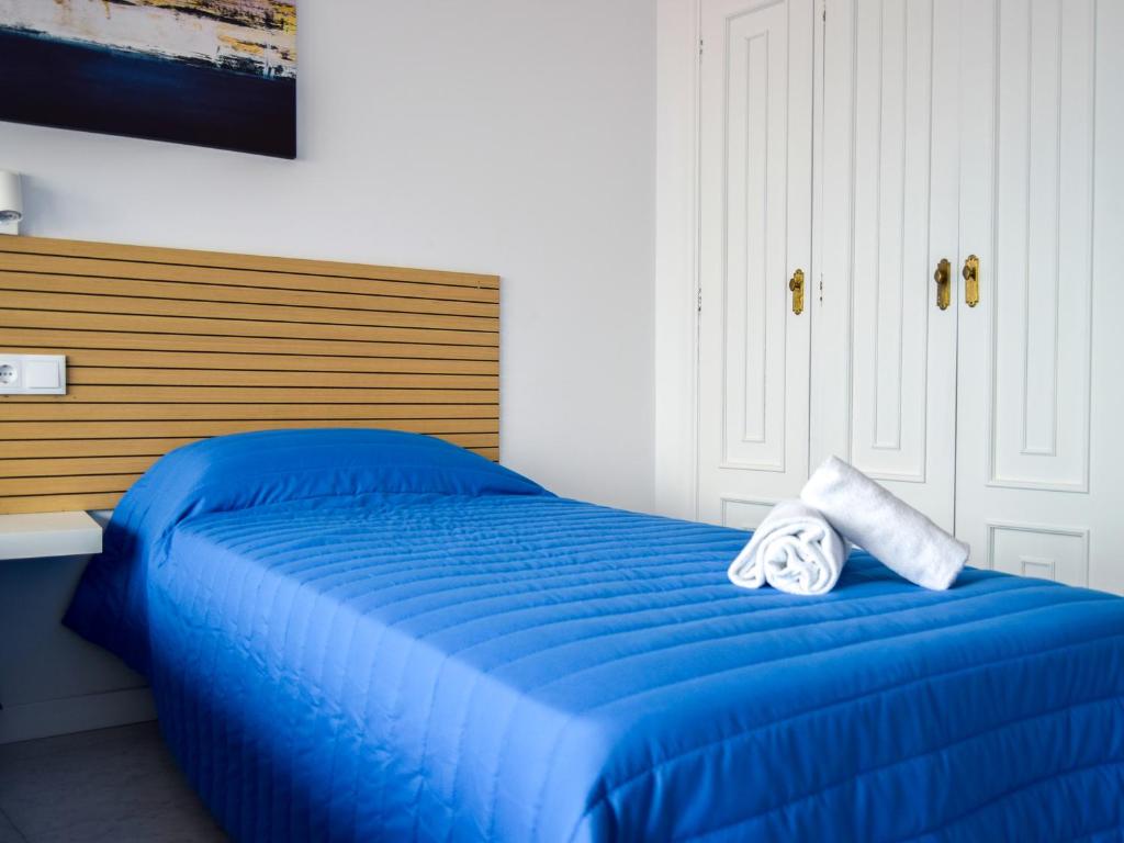 Cama o camas de una habitación en Complejo Tamanaco Illa de Arousa 3000