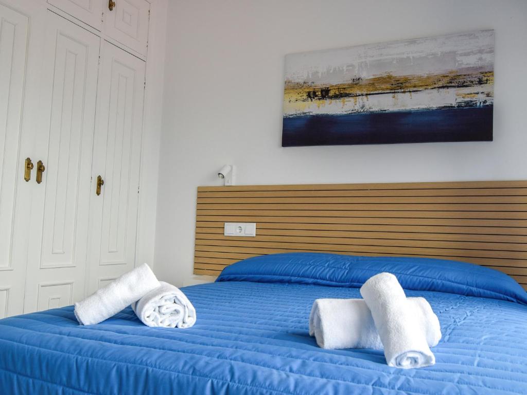 Cama o camas de una habitación en Complejo Tamanaco Illa de Arousa 3000