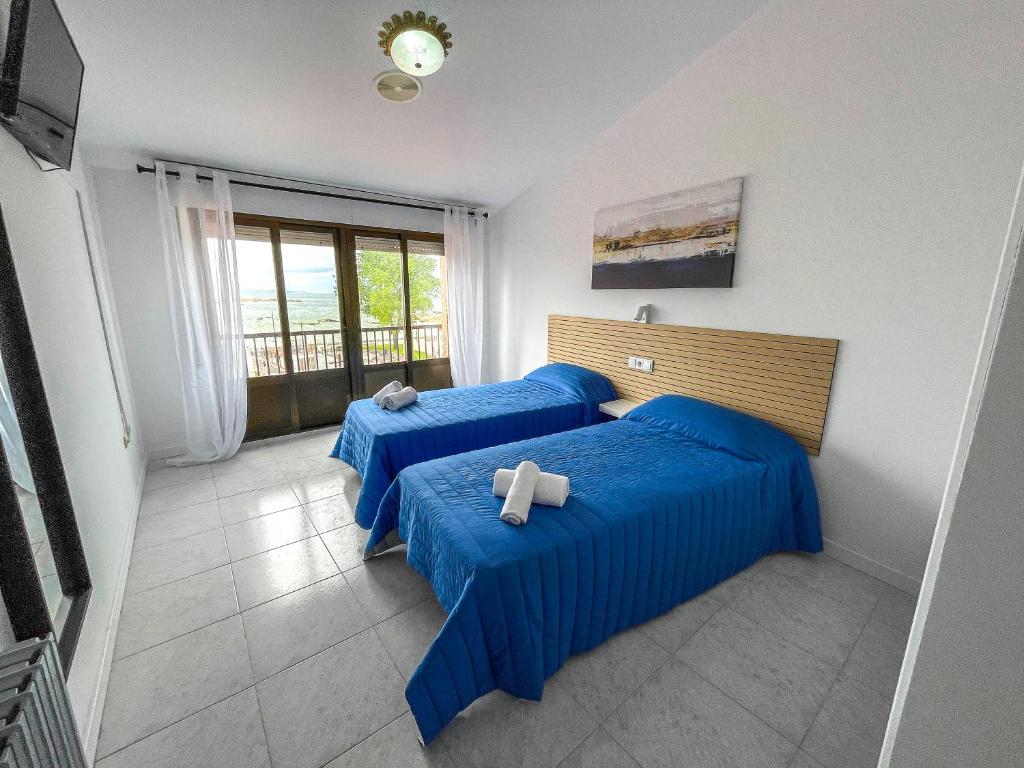 Cama o camas de una habitación en Complejo Tamanaco Illa de Arousa 3000