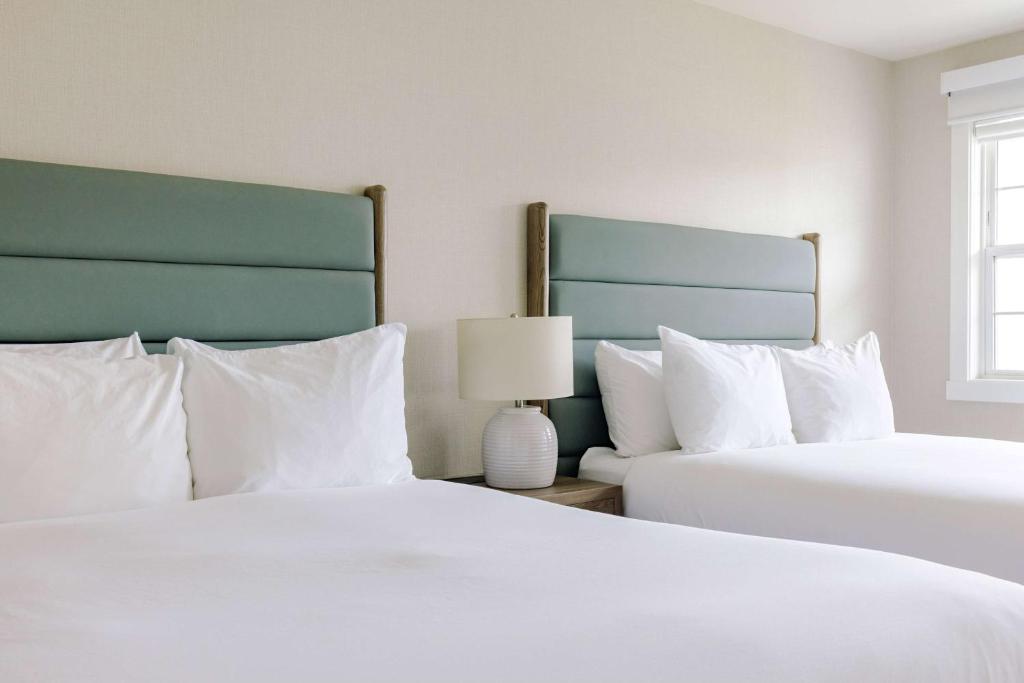 Postel nebo postele na pokoji v ubytování Balcomo, a Ramada by Wyndham
