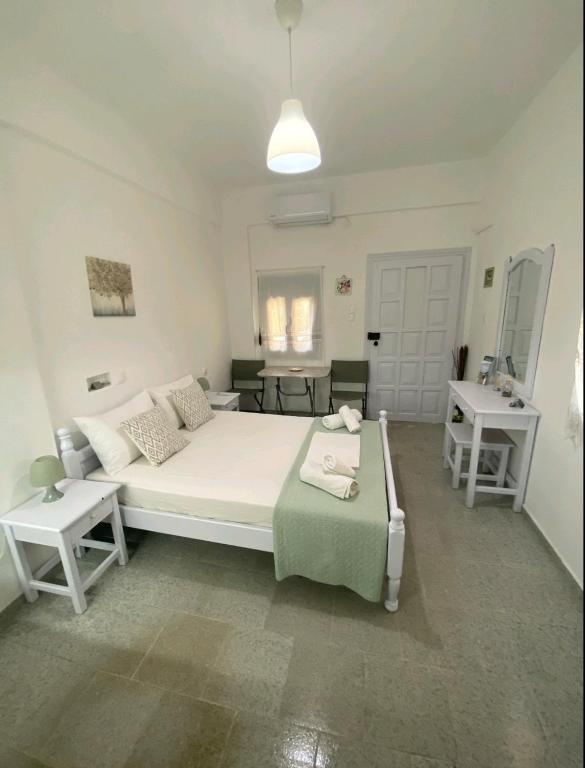 Postel nebo postele na pokoji v ubytování Garden Rooms